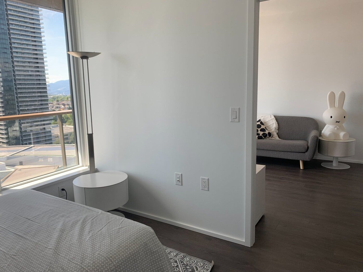 View from bedroom to living room showing open layout